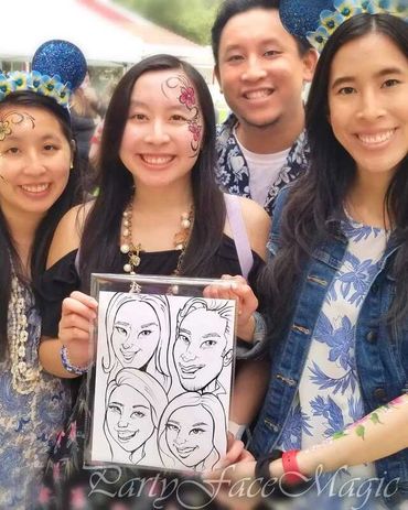 Three asian women & one male adult with face paintings, holding a caricature drawing all on 1 sheet.