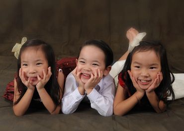 Christian, Lauren and Justine in a cute pose on their tummy and elbows.