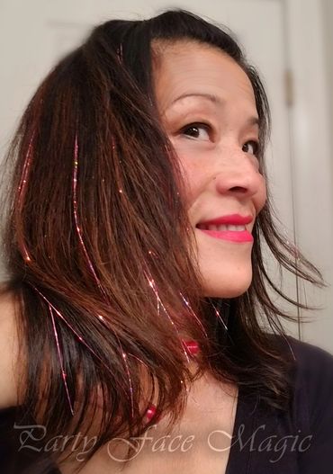 Cassie showing off her pink hair tinsels!