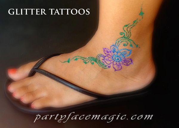 Party Face Magic Freehanded Glitter Tattoo design on the ankle.