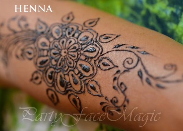 Party Face Magic close up of Flower Henna design on arm.
