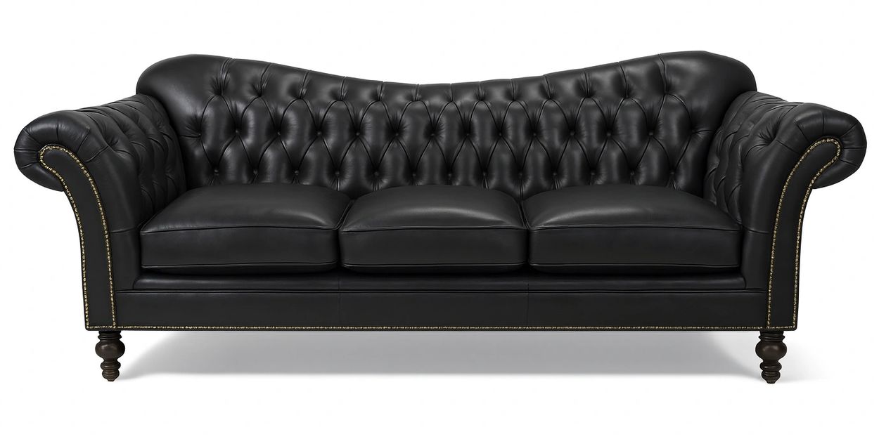 Elegant black leather Chesterfield sofa with tufted back and rolled arms.