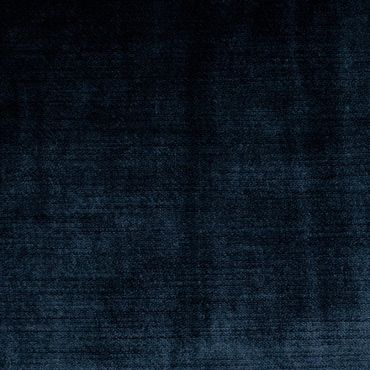 Dark blue textured fabric with subtle variations.