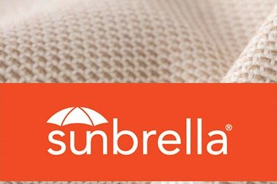 Sunbrella logo on textured beige fabric background.