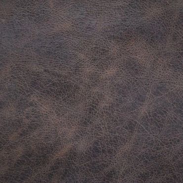 Close-up of textured brown leather surface with natural creases.