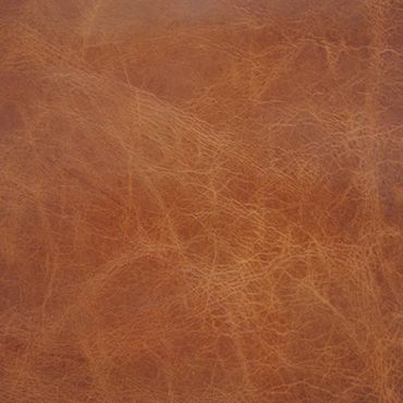 Close-up of textured brown leather surface.