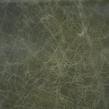 Close-up of greenish leather texture with fine wrinkles and creases.