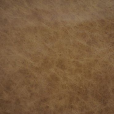 Close-up of textured brown leather surface.
