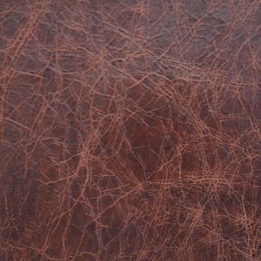 Close-up of textured brown leather surface with visible wrinkles and creases.