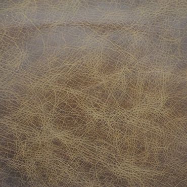 Close-up of textured brown leather surface.