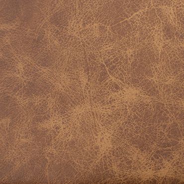 Close-up of textured brown leather surface with natural wrinkles and creases.