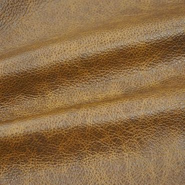Close-up of textured brown leather surface with natural creases.