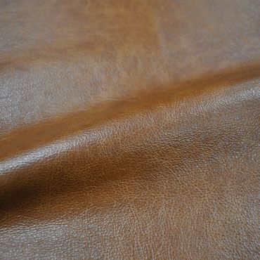 Close-up of textured brown leather material.