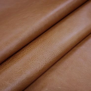 Close-up of folded brown leather with visible texture.