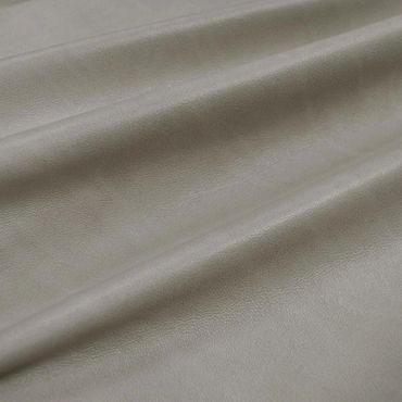 Soft, smooth grey fabric with gentle folds.