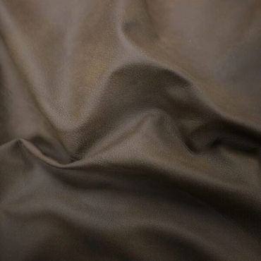 Smooth, dark brown leather fabric with natural creases and texture.