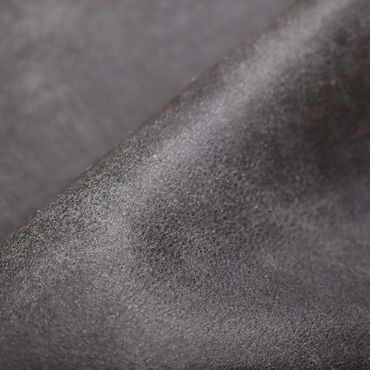 Close-up of textured gray fabric surface.