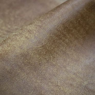 Close-up of textured brown leather surface.