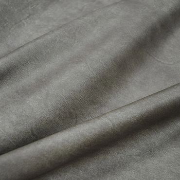 Close-up of soft gray fabric with subtle texture and folds.