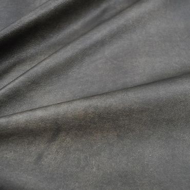 Close-up of textured gray leather material with natural creases.