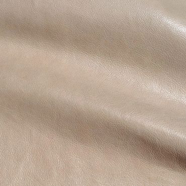Close-up of beige leather texture with natural grain and subtle sheen.