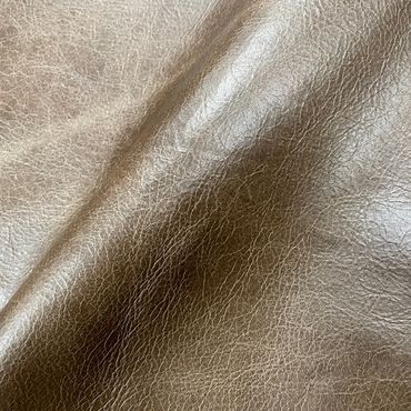 Close-up of textured brown leather material.