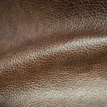 Close-up texture of brown leather material.
