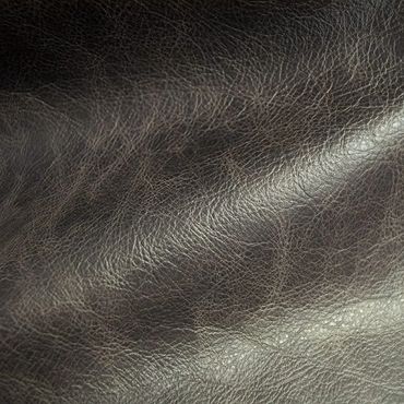 Close-up of textured black leather surface.
