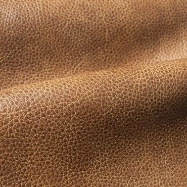 Close-up of textured brown leather fabric.