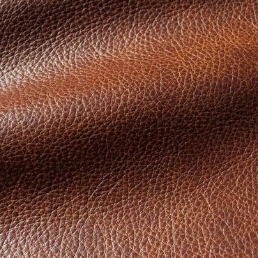 Close-up of textured brown leather surface.