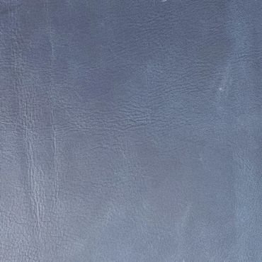 Close-up of textured gray leather surface.