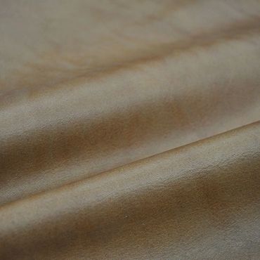 Close-up of smooth brown leather texture.