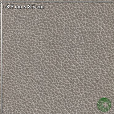 Close-up of textured gray leather material with measurement scale.