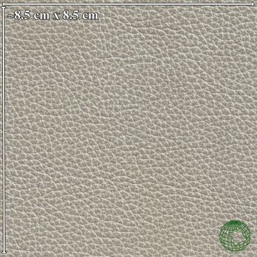 Close-up of textured beige leather material with measurement scale.