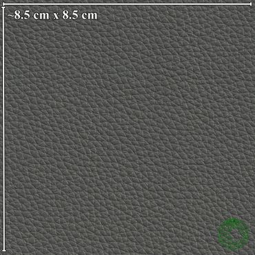 Close-up of textured dark gray leather material with size reference.