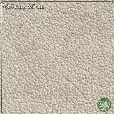 Close-up of textured beige leather surface with grain details.