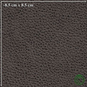 Close-up of black leather texture with grain pattern.