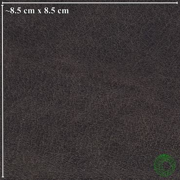 Close-up of dark brown textured leather with size reference of 8.5 cm by 8.5 cm.