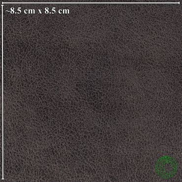 Close-up of dark textured leather, measuring approximately 8.5 cm by 8.5 cm.