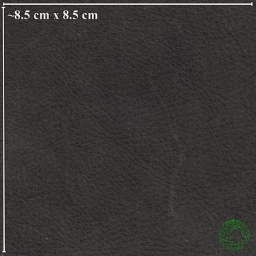 Close-up of black leather texture with natural grain.