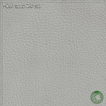 Close-up of a textured light gray leather surface.