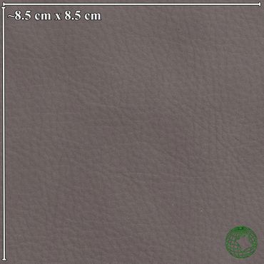 Close-up of textured gray leather fabric with a small green globe logo in the corner.