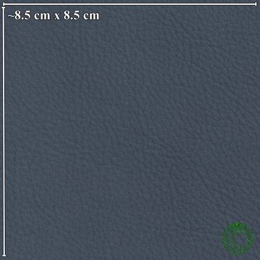 Close-up of textured dark blue leather surface with size reference.