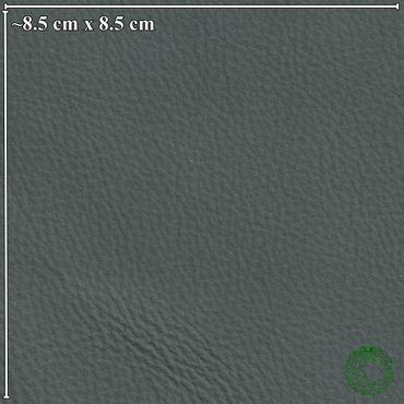 Close-up of dark textured leather surface with dimensions shown.