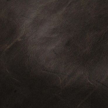 Close-up texture of dark brown leather with natural creases and grain.
