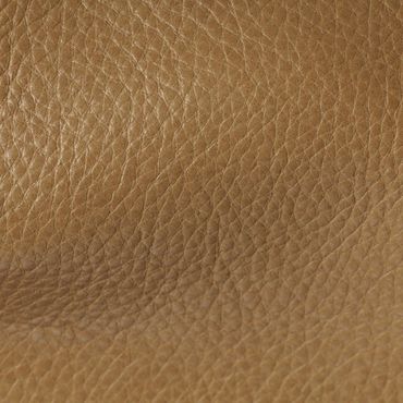 Close-up of textured brown leather surface.