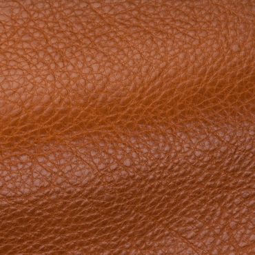 Close-up of textured brown leather surface.