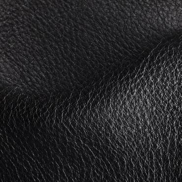 Close-up of black textured leather material.