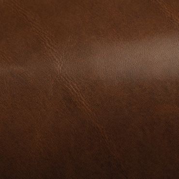 Close-up of brown leather texture with natural grain and slight sheen.