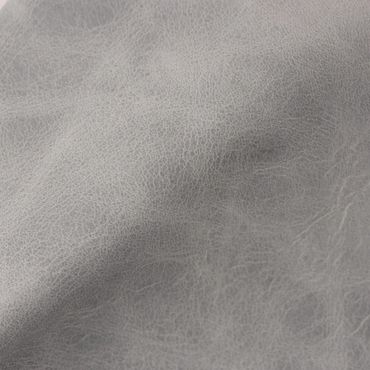 Close-up of textured light gray leather material.